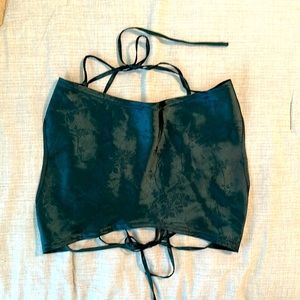 Crop top featuring tie around neck and waist. Beautiful subtle floral material.